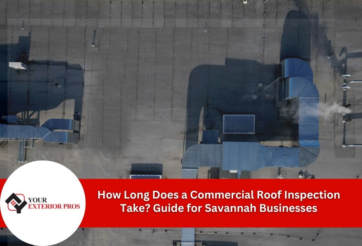 Aerial view of commercial building rooftop with HVAC units and ventilation systems